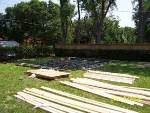 Vapor barrier laid out, and lumber staged 