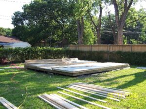 Deck laid, walls framed & sheathed, and rafters staged 